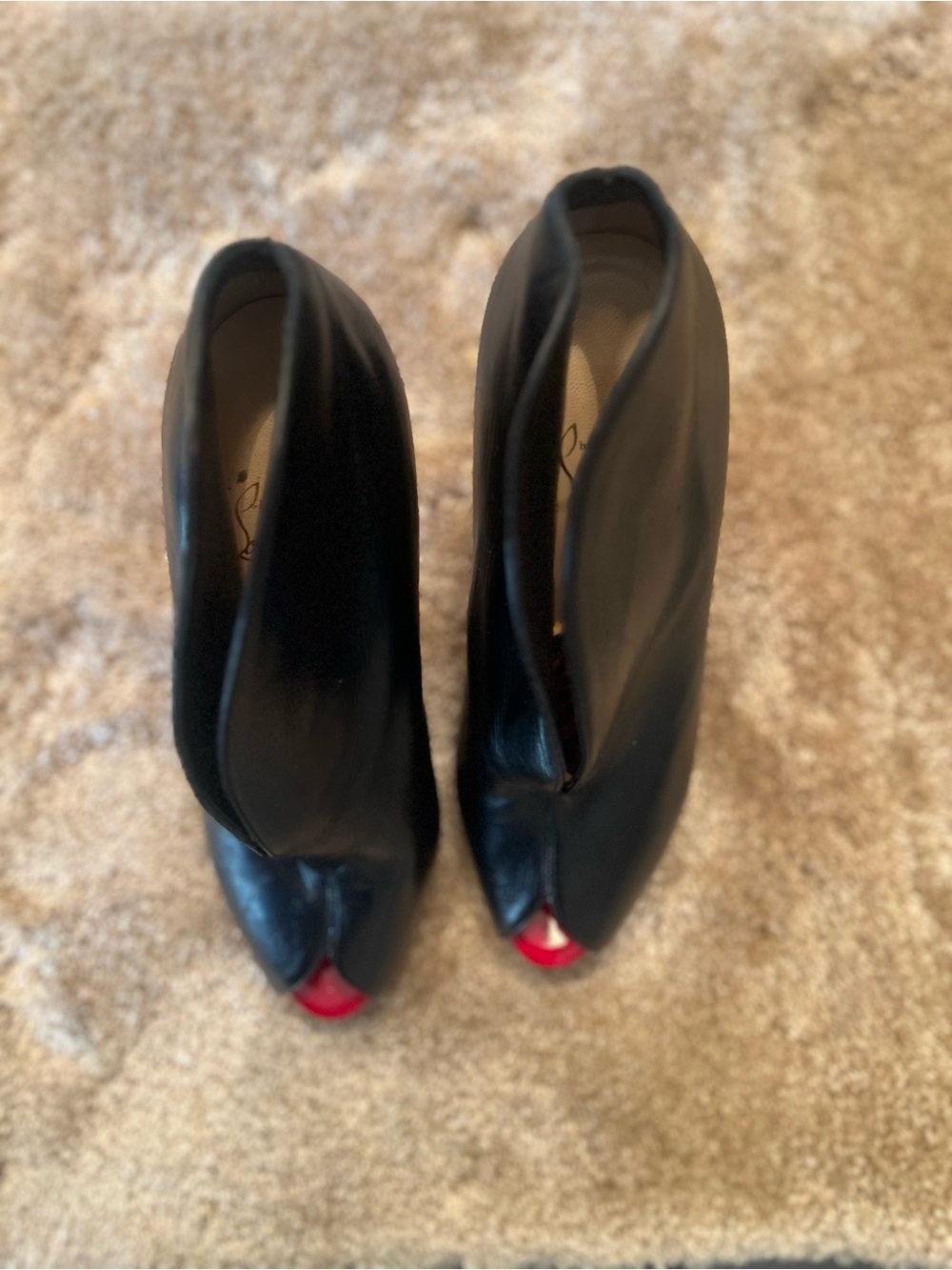 Christian Louboutin Black Leather Peep-Toe Ankle Boots with Red Accents.